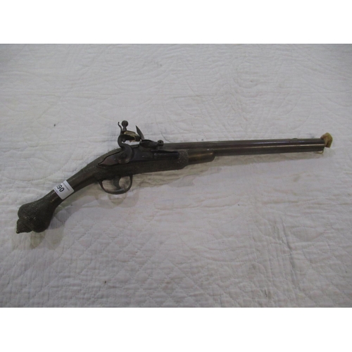 890 - C19th Arabic flintlock pistol with ornate carving to lock, handle and pommel, overall approx L19