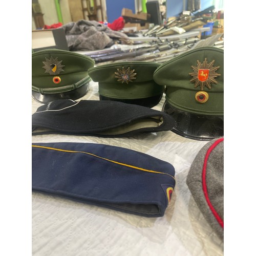 196 - Selection of post-1950 German peak caps, forage caps and a beret (7)