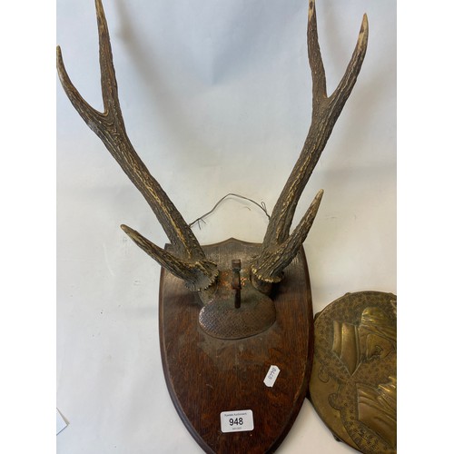 948 - Wall mounted brass and copper gong, with red deer antlers on wooden plaque