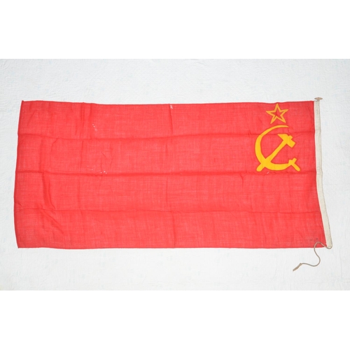 369 - A large USSR flag with hammer and sickle. Size approx 181x88cm