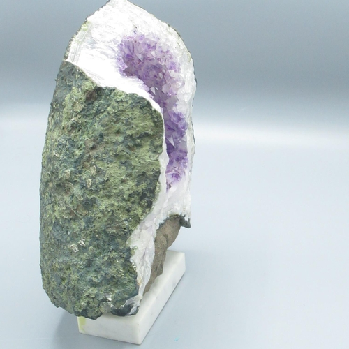 573 - Amethyst geode mineral specimen on fitted base, H24cm