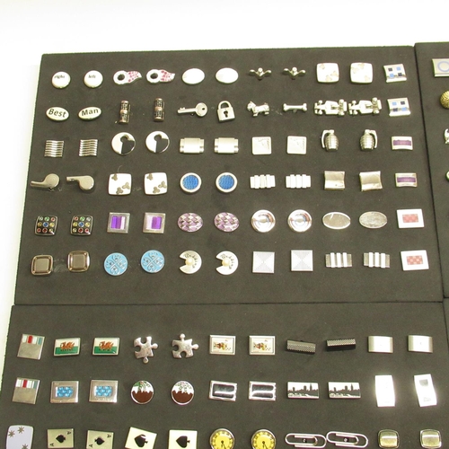 574 - Collection of pairs of modern cufflinks in 4 black foam trays