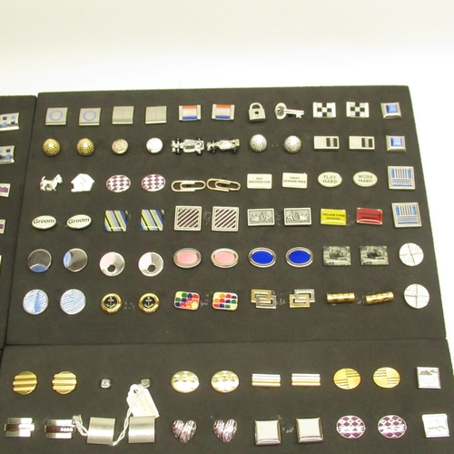 574 - Collection of pairs of modern cufflinks in 4 black foam trays