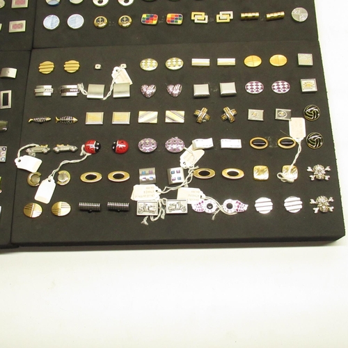 574 - Collection of pairs of modern cufflinks in 4 black foam trays