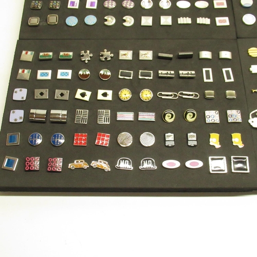 574 - Collection of pairs of modern cufflinks in 4 black foam trays