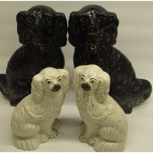 439 - Pair of Staffordshire pottery 'Jackfield' seated dogs, and another pair of Staffordshire seated dogs... 