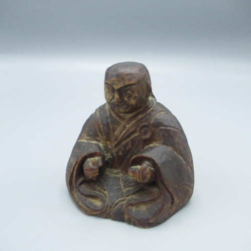 435 - C20th oriental carved wooden incense burner in the form of a man meditating, signed with character m... 