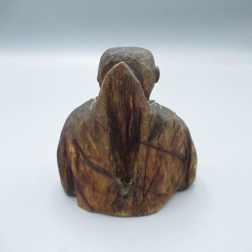 435 - C20th oriental carved wooden incense burner in the form of a man meditating, signed with character m... 