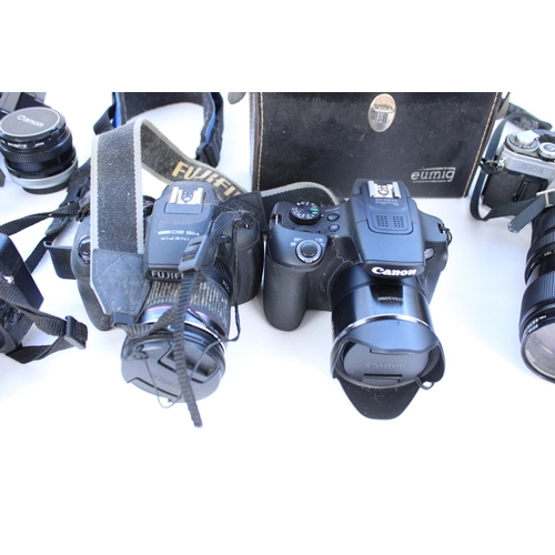 1246 - Collection of cameras and camera equipment and accessories to include Canon AE-1 with Vivitar 75-205... 