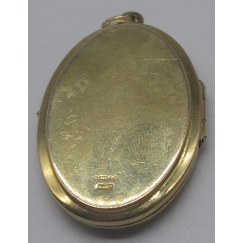 1254 - 9ct yellow gold locket with engraved detail to front, stamped 375, 19.6g