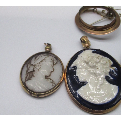 29 - Cameo brooch of a terrier mounted in 18ct yellow gold, stamped 750, a white cameo brooch on 9ct yell... 
