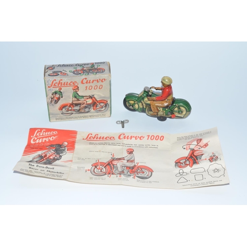 1284 - Schuco Curvo 1000 early 1950s tinplate clockwork motorcycle with original box and instruction sheet,... 