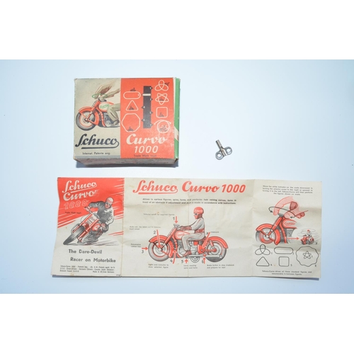 1284 - Schuco Curvo 1000 early 1950s tinplate clockwork motorcycle with original box and instruction sheet,... 