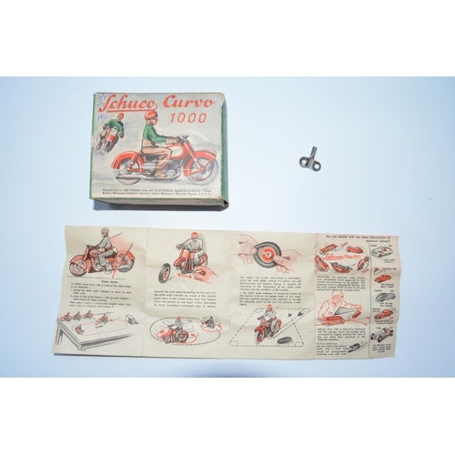 1284 - Schuco Curvo 1000 early 1950s tinplate clockwork motorcycle with original box and instruction sheet,... 