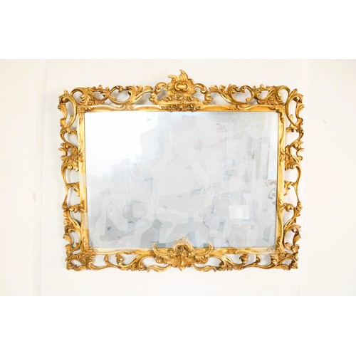 1239 - Late C19th French Rococo mirror, rectangular plate in pierced C scroll gilt wood frame, with cabocho... 