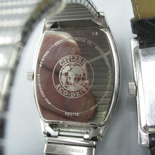 605 - Citizen Eco-Drive wristwatch with date, chrome plated rectangular case, on leather strap and another... 