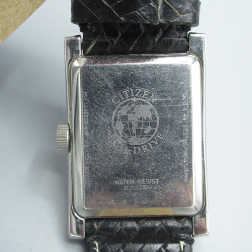 605 - Citizen Eco-Drive wristwatch with date, chrome plated rectangular case, on leather strap and another... 