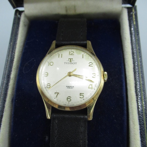 613 - Tissot gold cased hand wound wristwatch, signed silvered dial with applied Arabic numerals and centr... 