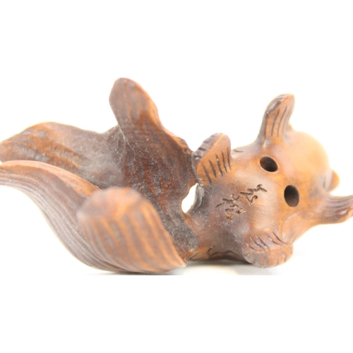 1359 - Japanese Meiji period boxwood Netsuke figure of two frogs, H4.5cm and a fish Netsuke