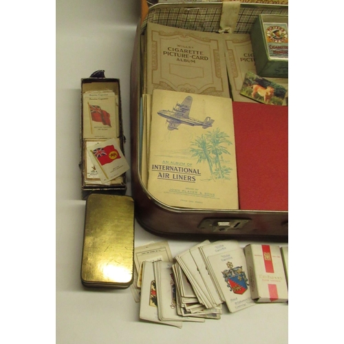 1433 - Collection of cigarette cards in folders and loose inc. Kenistas silks, in one suitcase