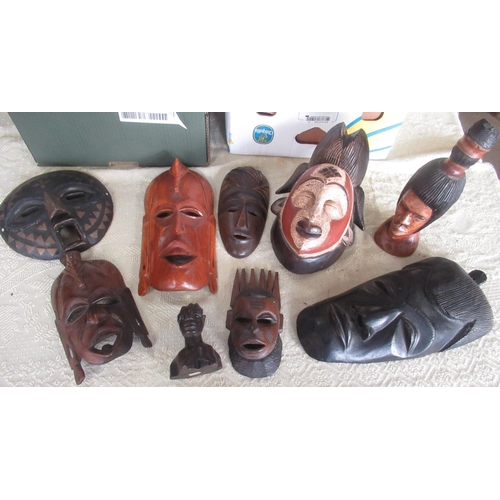 3 - Collection of various carved wood tribal busts and figures, some with painted detail, beads, feather... 