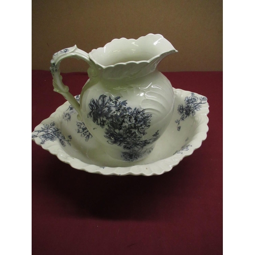 25 - Victorian Earthenware toilet jug and bowl printed with blue foliage on white ground H27cm (A/F)