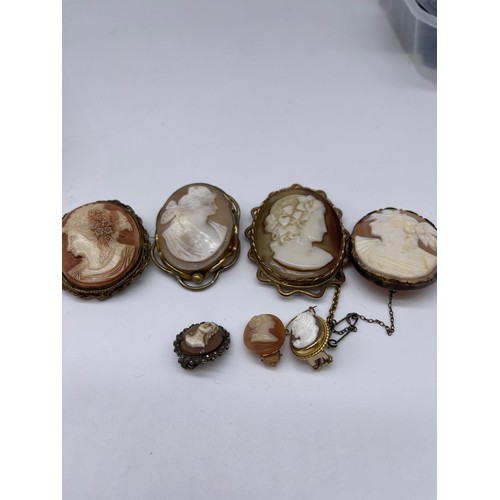 41 - Four Victorian and later cameo brooches, all on yellow metal mounts, and three unmatched cameo earri... 