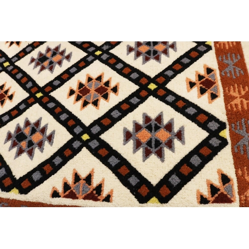 652 - Tunisian wool pile rug with tasselled ends, 150x79cm