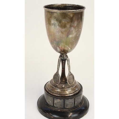 1331 - Geo. V hallmarked silver tennis trophy, the  ebonized stepped base, set with silvered plaques with t... 