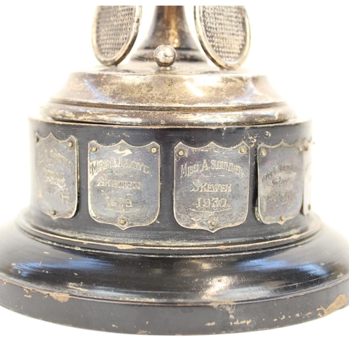 1331 - Geo. V hallmarked silver tennis trophy, the  ebonized stepped base, set with silvered plaques with t... 