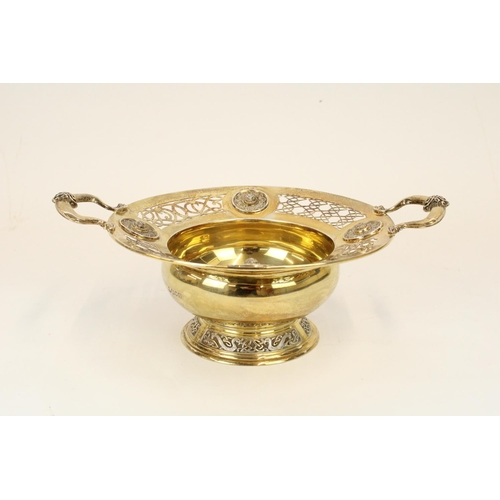 1333 - Edw. VII Arts and Crafts hallmarked silver gilt two handled pedestal bowl, decorated throughout in N... 