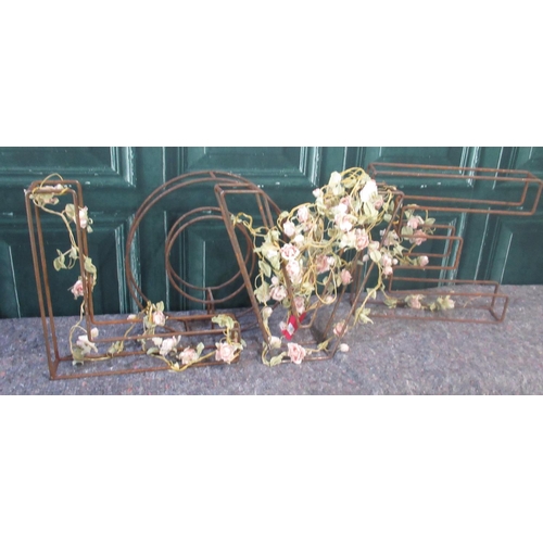 321 - Set of four open work metal letters LOVE, entwined with roses and a cast metal wall rack, W70cm H60c... 