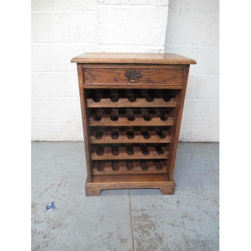 340 - Oak 25 bottle wine cabinet, single drawer above five pull out racks, on bracket feet, W60cm D37cm H8... 