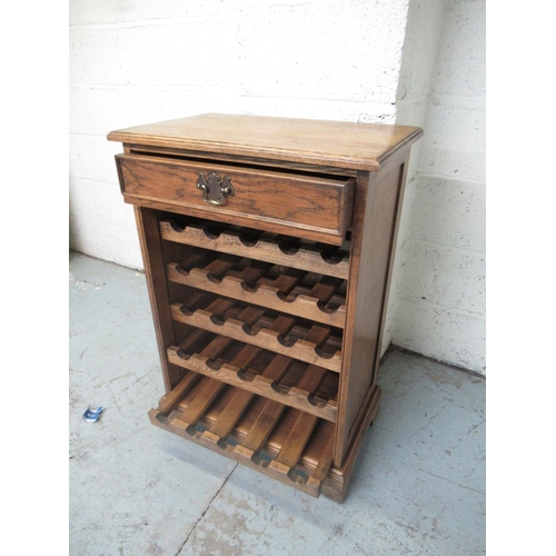 340 - Oak 25 bottle wine cabinet, single drawer above five pull out racks, on bracket feet, W60cm D37cm H8... 