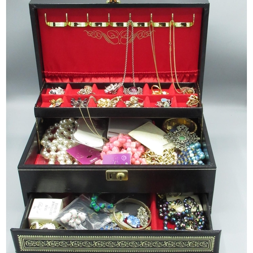 1222 - Black leather cantilever jewellery box containing costume jewellery including brooches, bracelets, e... 