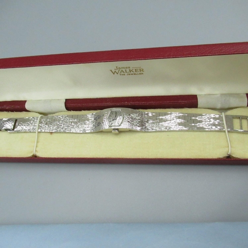 1223 - Ladies Avia late 1970's hand wound wristwatch, silver plated on integrated bark effect bracelet, wat... 