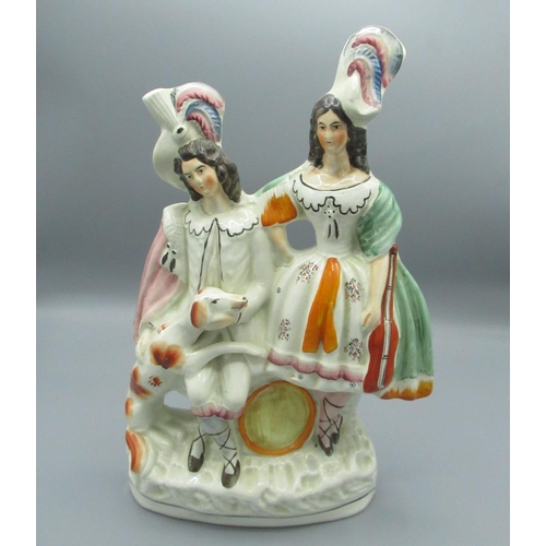 1369 - C19th Staffordshire group of highland couple with dog, H32.5cm