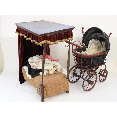 1243 - C20th dolls four poster bed in the manner of Heals, H59cm, a later dolls pram and vintage dolls clot... 