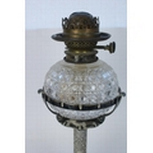 1248 - Late C19th Hukin and Heath silver plated oil lamp and matching candleholders, profusely embossed in ... 