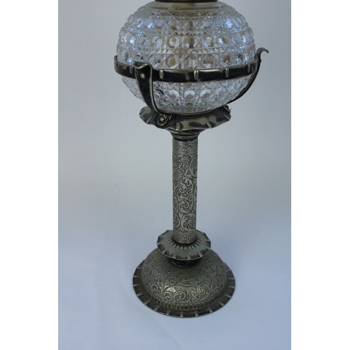 1248 - Late C19th Hukin and Heath silver plated oil lamp and matching candleholders, profusely embossed in ... 