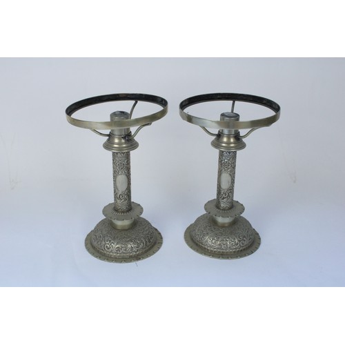 1248 - Late C19th Hukin and Heath silver plated oil lamp and matching candleholders, profusely embossed in ... 