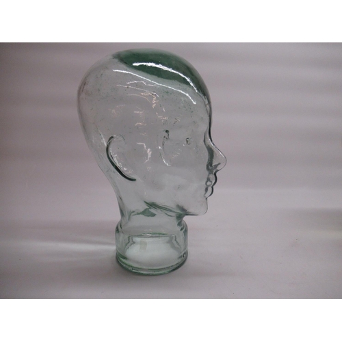 1384 - Two moulded glass phrenology type heads, H26cm and H30cm (2)