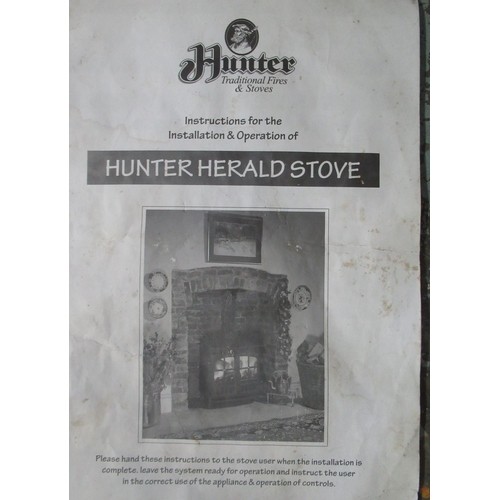 284 - Hunter Herald two door cast iron log burning stove with instructions, H66cm W45cm