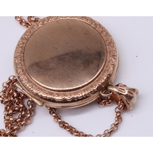 633 - Rose coloured metal circular locket pendant with engraved design, no hallmark, on 9ct rose gold bail... 