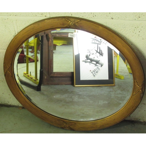 1366 - C20th oval bevelled edge wall mirror in reed and ribbon tied gesso frame, W86cm H71cm