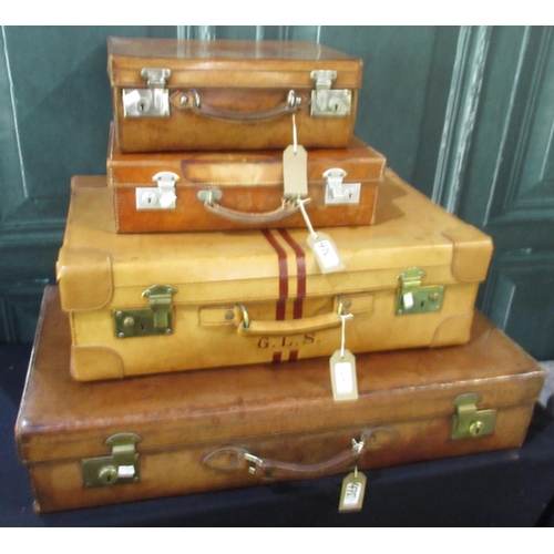 475 - Four leather suitcases, including three with monograms, W76cm D40 H15cm max (4)