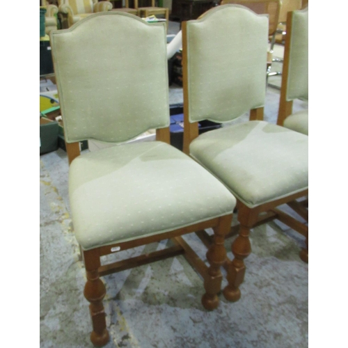 691 - Late C20th set of four golden oak dining chairs, upholstered seat and back panels (4)