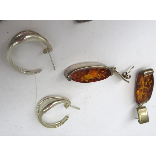 1268 - Sterling silver pendant set with amber, stamped 925, on white metal chain with leaf and fruit decora... 