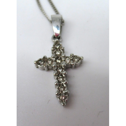 1272 - 9ct white gold crucifix necklace set with diamonds, on 9ct white gold chain, both stamped 375, a pai... 