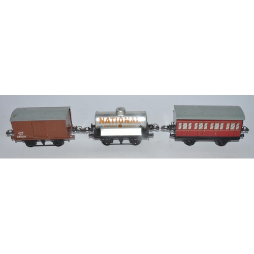 76 - Collection of vintage Hornby O gauge railway wagons, track, clockwork 040 